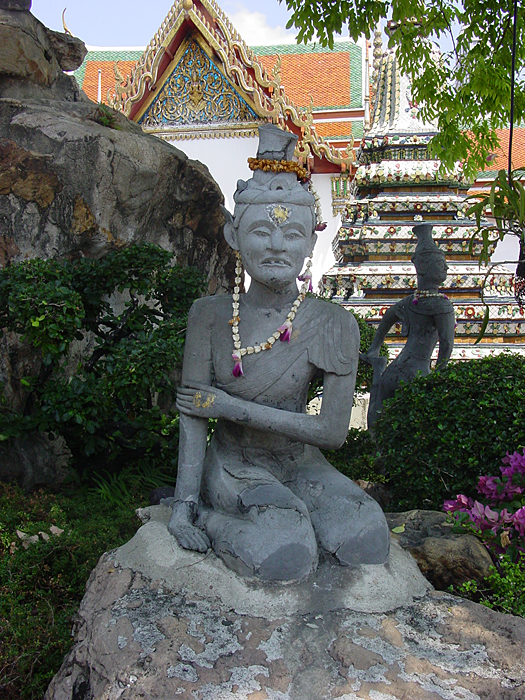 Hermits are present around the Compound at Wat Pho, massaging themselves. This Hermit seems to be in a lot of Pain. 