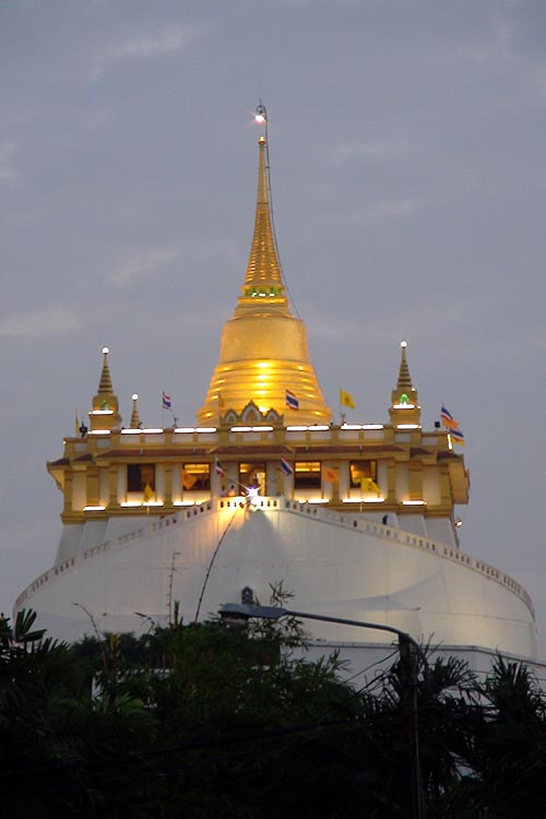 Golden Mount at dusk, as seen from the distance. Notice the boat-like shape of the surrounding wall..