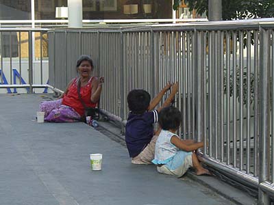 Beggars on a Pedestrian Bridge in Bangkok