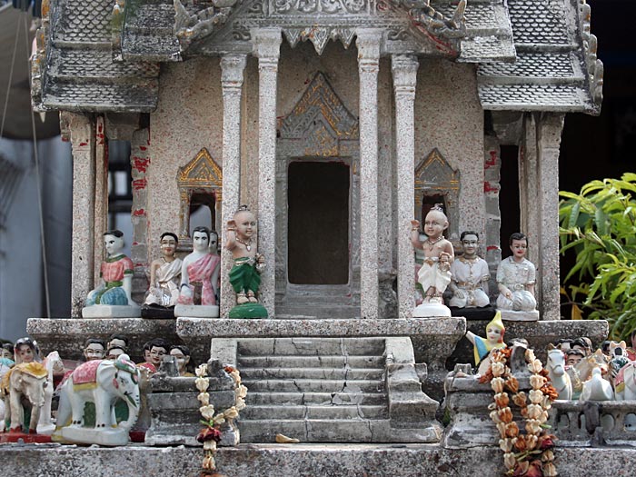 Figurines at Thai Spirit Houses, in Bangkok. Seen at a car repair shop.